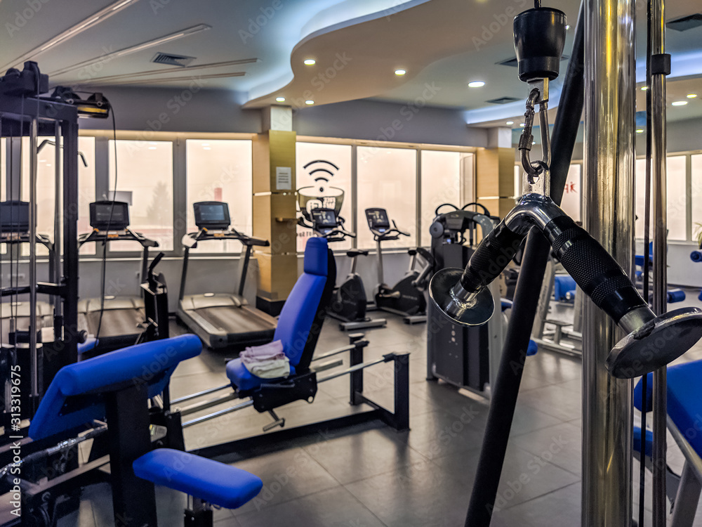 Body weights and dumbbells for arms, legs and bodybuilding biceps, triceps and chest, back. Modern gym for training every day. Body weights and dumbbells for arms, legs and bodybuilding biceps, triceps and chest, back. Modern gym for training every day.