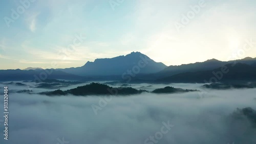 Wallpaper Mural 4K Aerial footage of beautiful nature landscape scene of tropical rainforest and clouds with Mount Kinabalu in Sabah, Borneo Torontodigital.ca