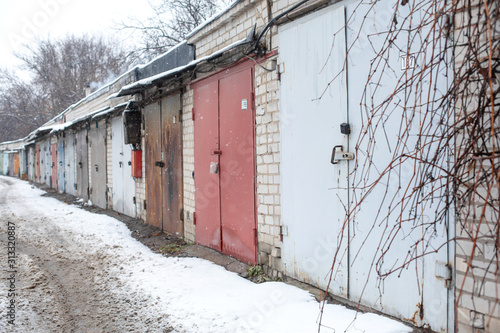 Old rusty garages in the CIS countries in the winter.