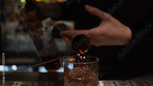 Pouring alcohol in glass