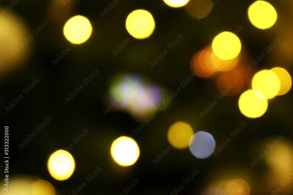 Obraz premium Long exposure blurred yellow and blue christmas tree lights abstract background