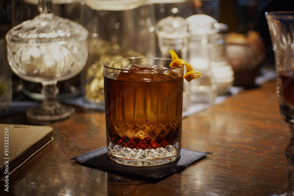 Alcohol cocktail with orange peel Alcohol cocktail with orange peel