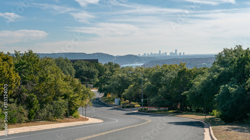 View of Road with Bike Lane with Downtown Austin Skyline in the background in a Sunny Day photo