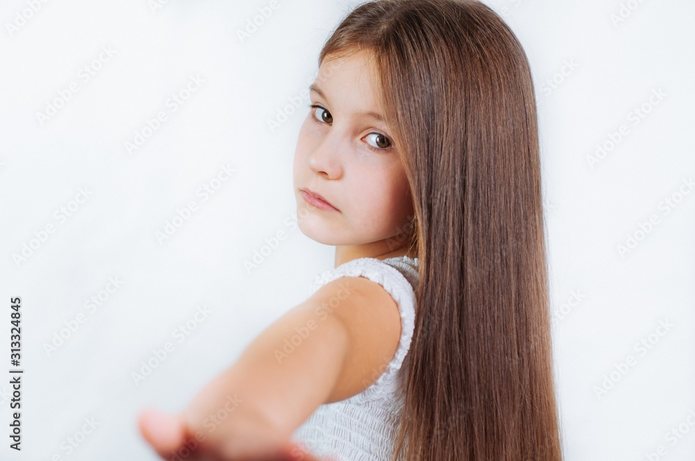 Naklejka premium Little girl face portrait in Girl child brush hair in fashionable dress