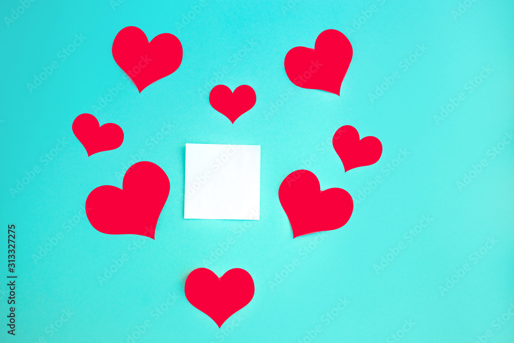 Valentine's Day background. Red hearts on pastel blue background. Valentines day concept. Flat lay, top view, copy space Valentine's Day background. Red hearts on pastel blue background. Valentines day concept. Flat lay, top view, copy space