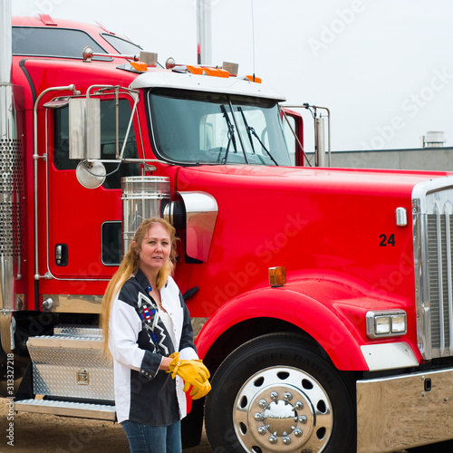 Woman Truck Driver Putting on her gloves