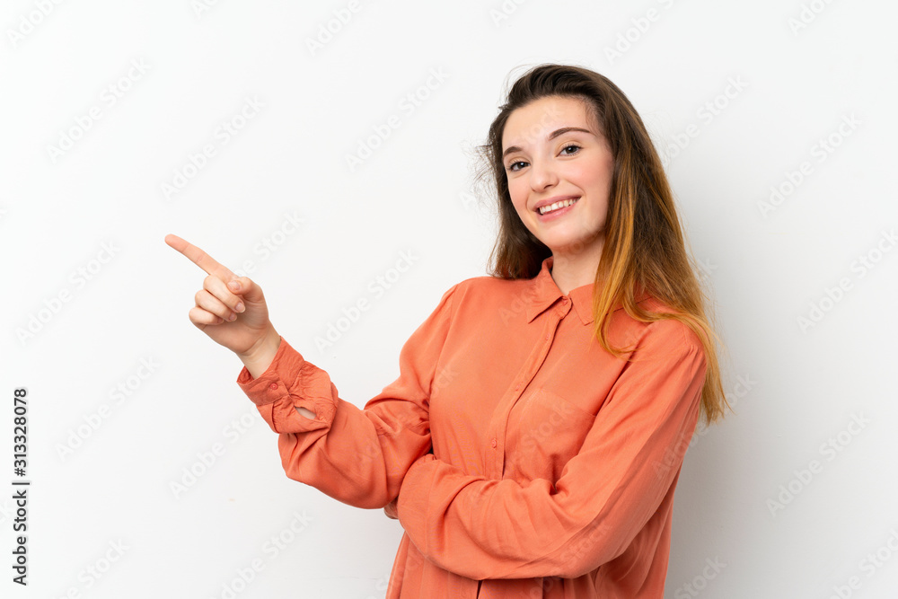 Young brunette girl over isolated white background pointing finger to the side Young brunette girl over isolated white background pointing finger to the side