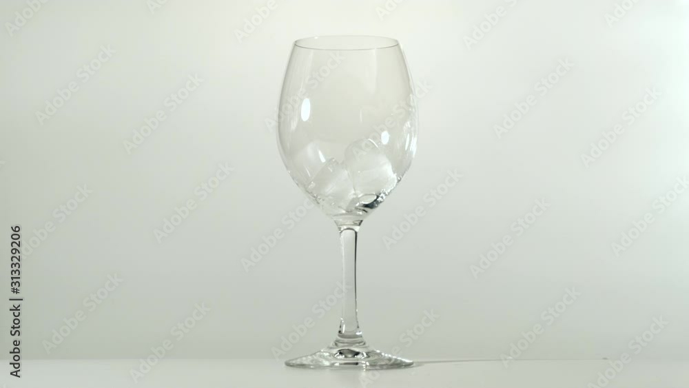 Ice cubes put in glass of clear water Ice cubes put in glass of clear water