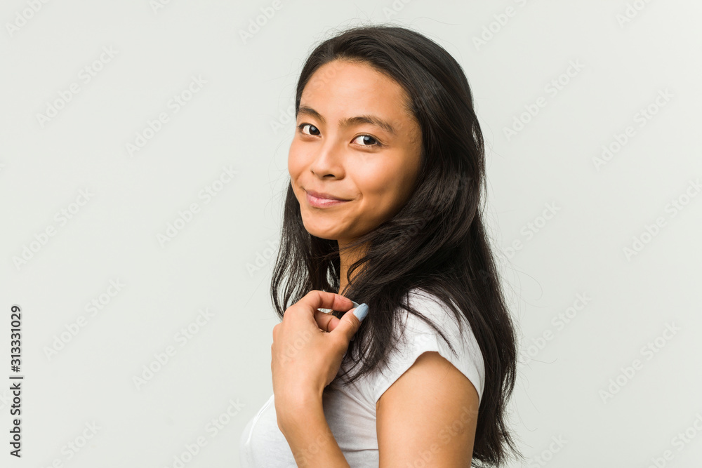 Young chinese woman posing on a white background Young chinese woman posing on a white background