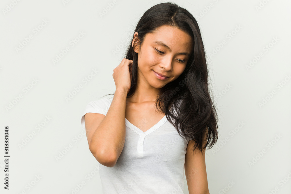 Young chinese woman posing on a white background Young chinese woman posing on a white background