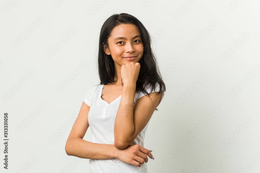 Young chinese woman posing on a white background Young chinese woman posing on a white background