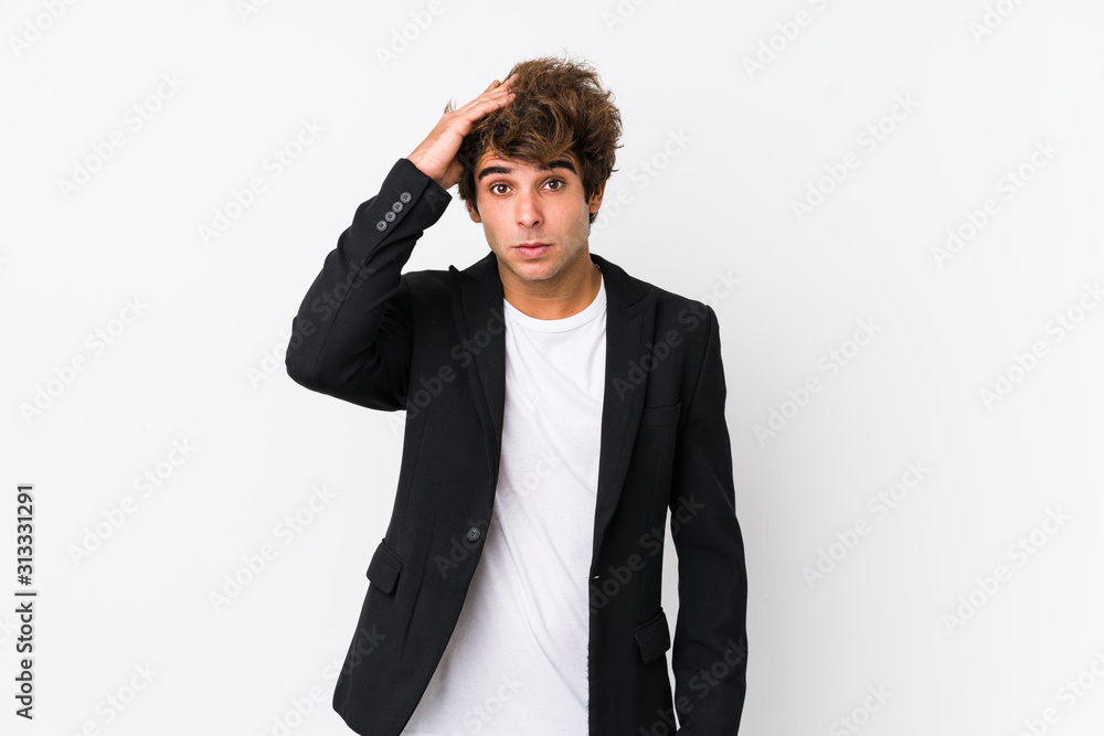 Young caucasian business man against a white background isolated being shocked, she has remembered important meeting. Young caucasian business man against a white background isolated being shocked, she has remembered important meeting.