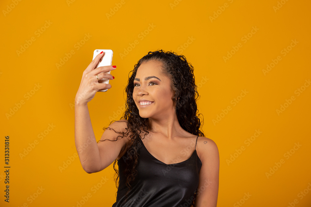 Self portrait of beautiful young afro american woman. Selfie concept Self portrait of beautiful young afro american woman. Selfie concept