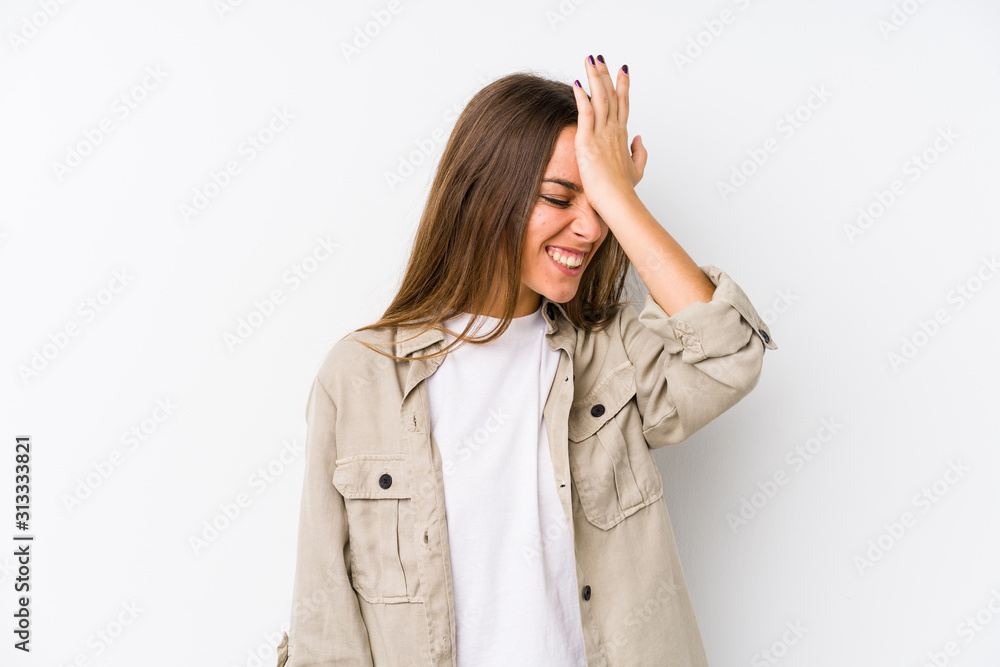 Young caucasian woman isolated forgetting something, slapping forehead with palm and closing eyes. Young caucasian woman isolated forgetting something, slapping forehead with palm and closing eyes.