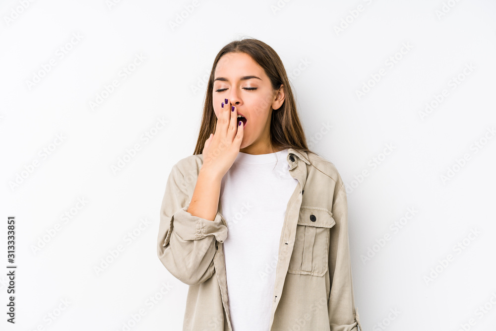 Young caucasian woman isolated yawning showing a tired gesture covering mouth with hand. Young caucasian woman isolated yawning showing a tired gesture covering mouth with hand.