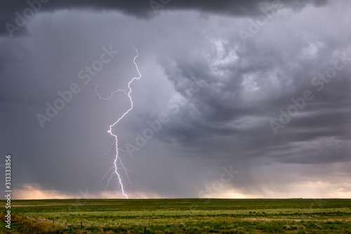 Lightning bolt and thunderstorm cloud with rain