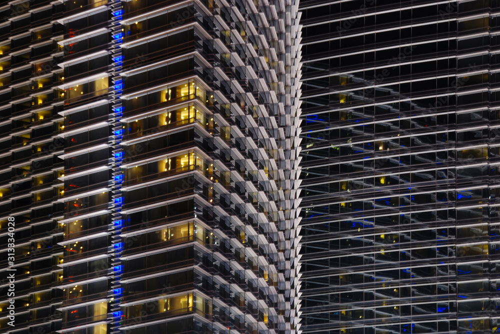 close up on modern facade at night as background close up on modern facade at night as background