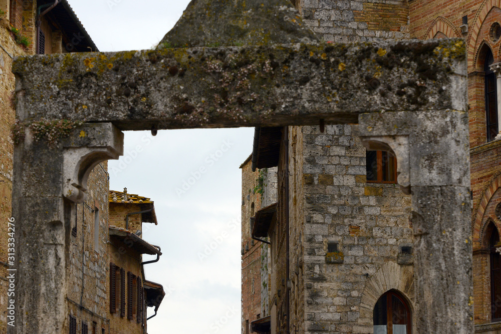 close up on facades of old buildings in Tuscany village