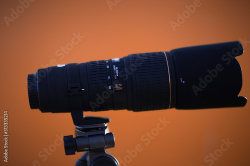 telephoto lens with yellow background