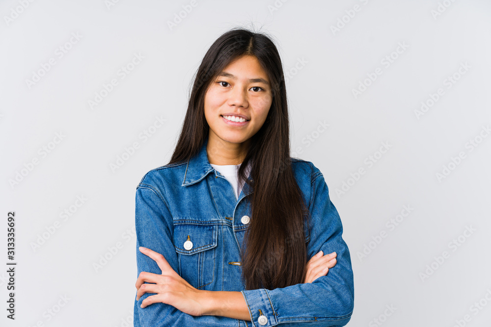 Young asian woman who feels confident, crossing arms with determination. Young asian woman who feels confident, crossing arms with determination.