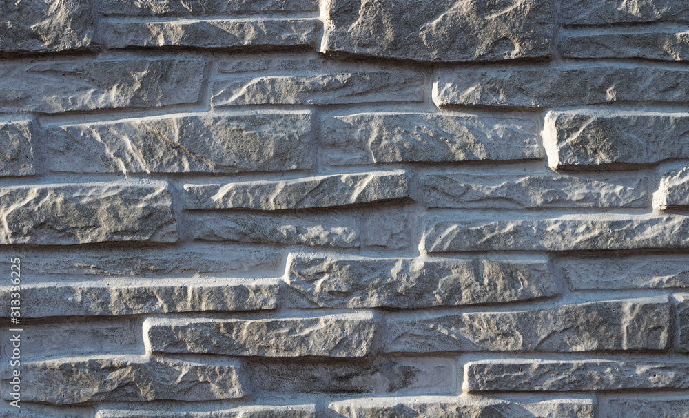 Texture of decorative white slate stone wall surface