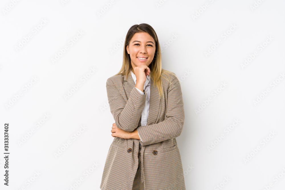 Young caucasian business woman isolated smiling happy and confident, touching chin with hand. Young caucasian business woman isolated smiling happy and confident, touching chin with hand.