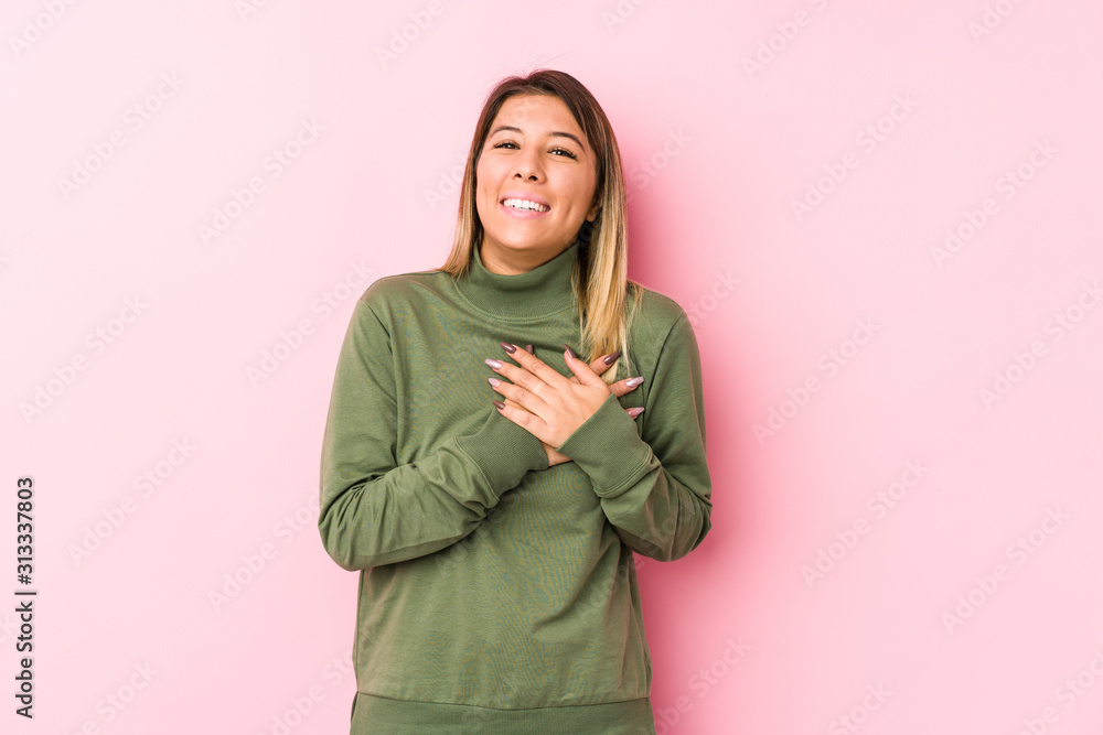 Young caucasian woman posing isolated has friendly expression, pressing palm to chest. Love concept. Young caucasian woman posing isolated has friendly expression, pressing palm to chest. Love concept.
