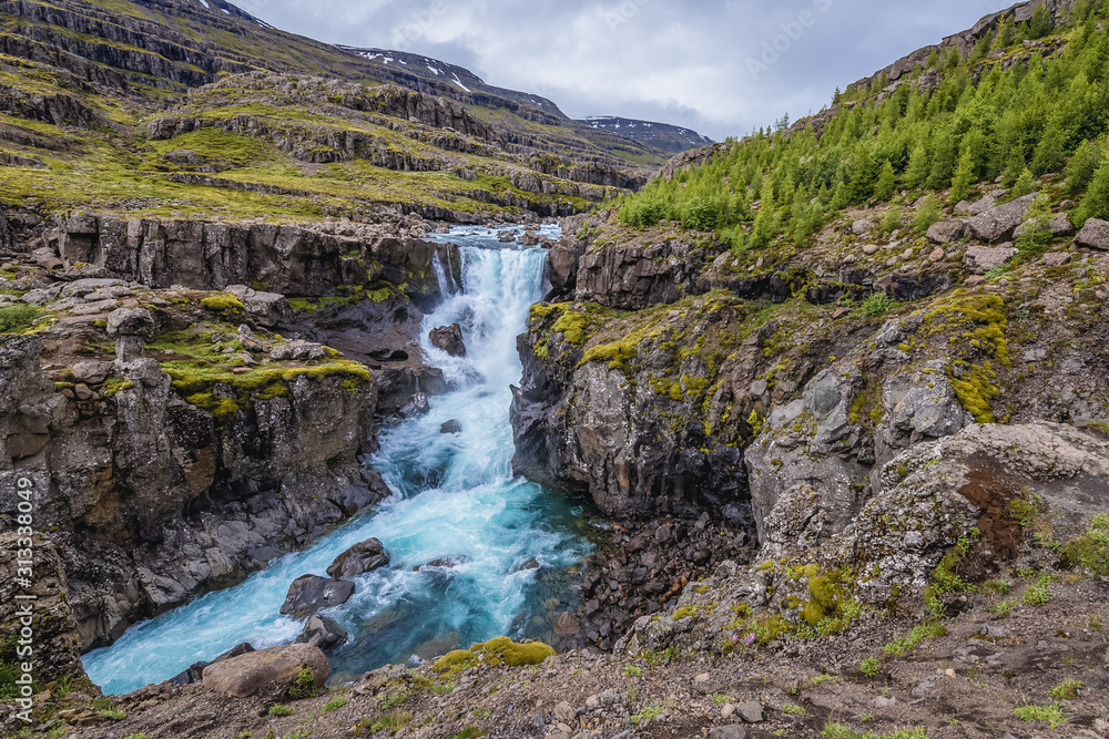 View on the Sveinsstekksfoss waterfall in eastern Iceland