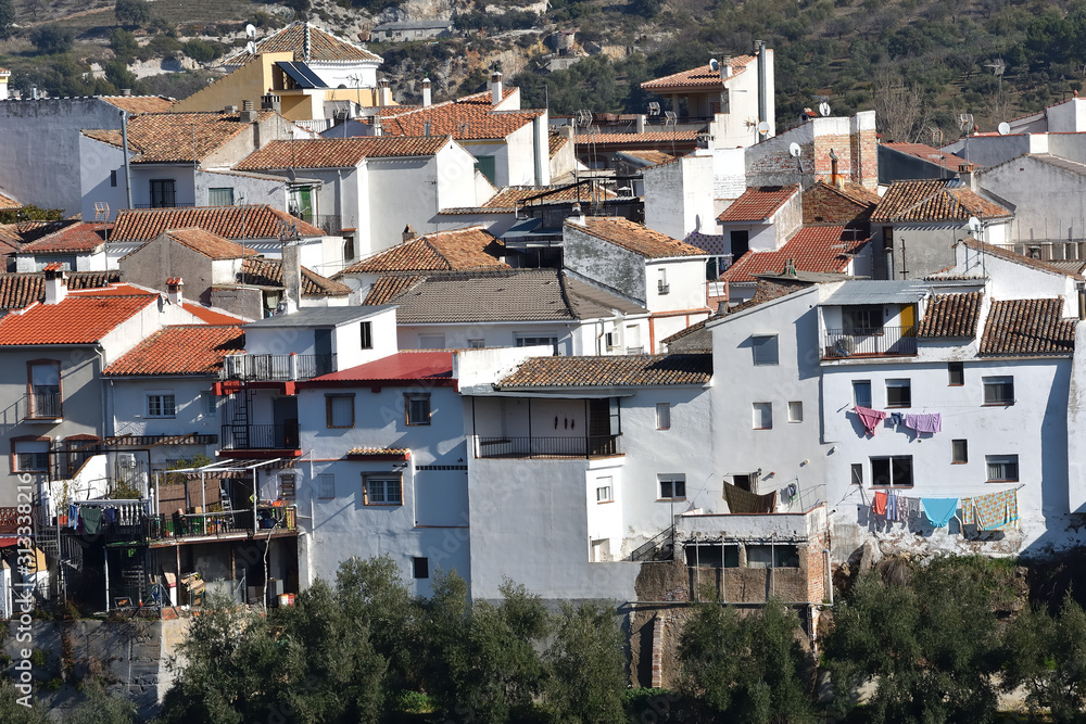 White houses of an Andalusian mountain village with details of everyday life White houses of an Andalusian mountain village with details of everyday life