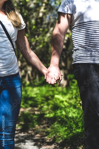 Couple holding hands. 