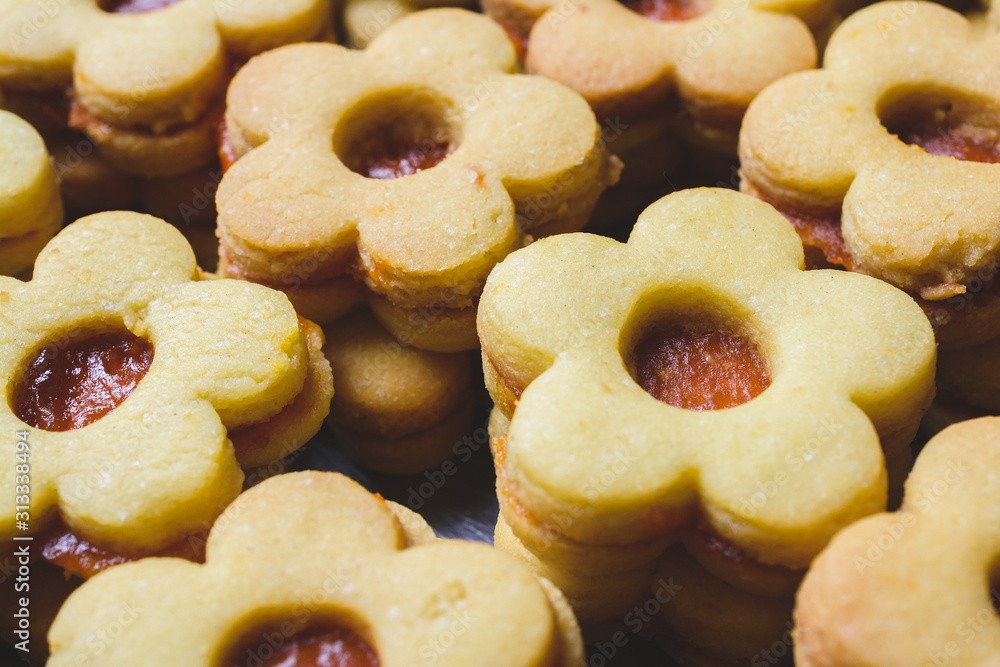 Flower shaped homemade cookies filled with jam