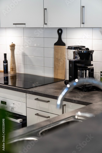 Interior kitchen shot with coffee maker.