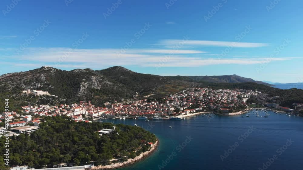 Drone circulating up to reveal the beautiful tourists city of Hvar on a beautiful island in Croatia Drone circulating up to reveal the beautiful tourists city of Hvar on a beautiful island in Croatia