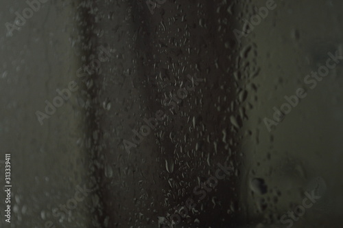 Water droplets that adhere to clear glass