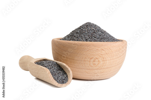 blue poppy seeds in wooden bowl and scoop isolated on white background. food ingredient. photo