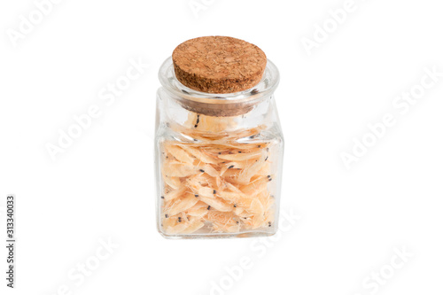 dried prawns dried prawns in a glass jar isolated on white background. food ingredient.
