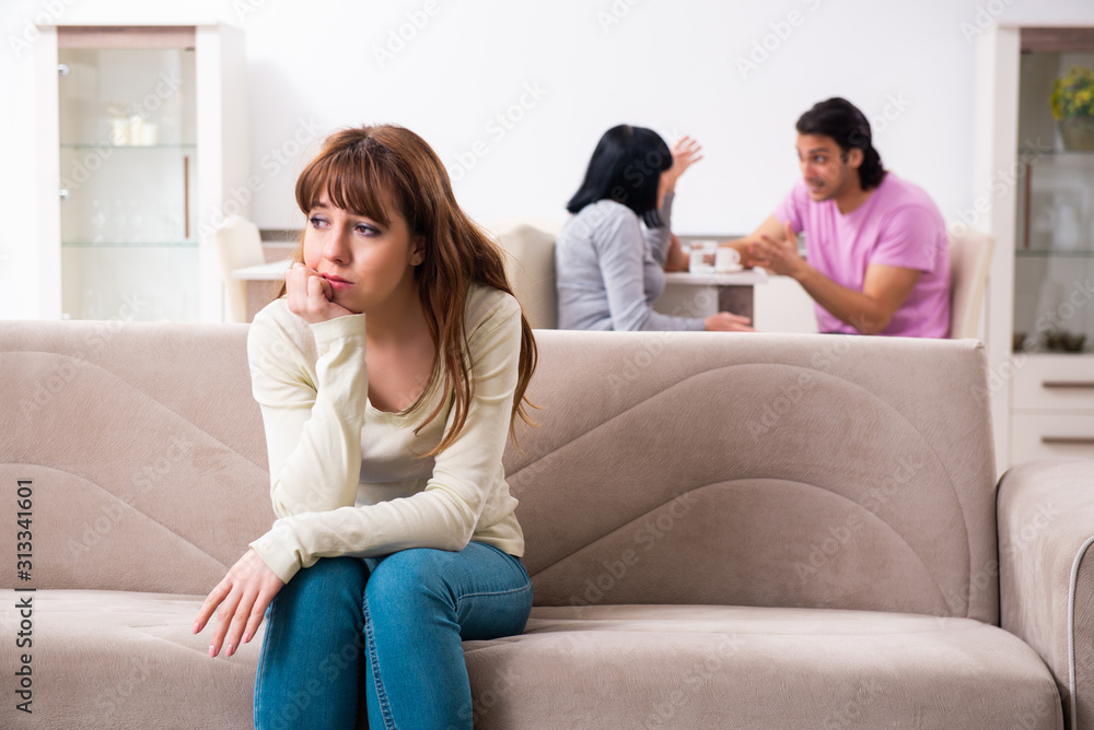 Young family and mother-in-law in family issues concept Young family and mother-in-law in family issues concept