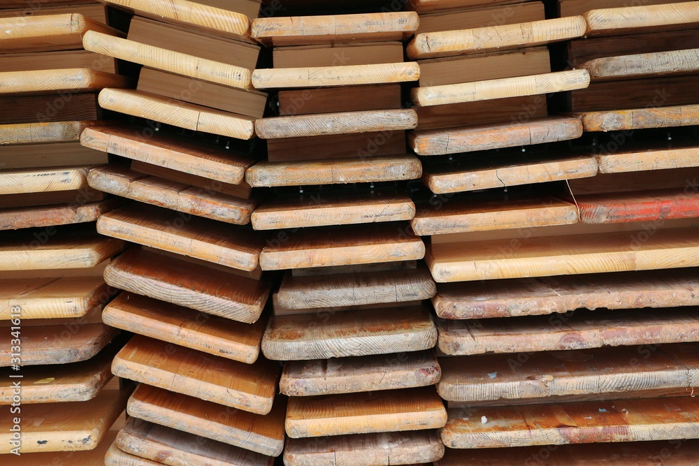 close up of a stack from Folded wood party tables and benches close up of a stack from Folded wood party tables and benches
