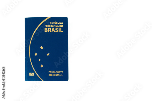 New Brazilian passport in a white background. with a write space. Passaporte Brasileiro, em fundo branco, com espaço para escrita. photo