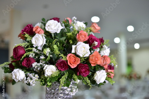 A luxurious bouquet of fresh flowers in a crystal vase on the holiday table and an elegant portion in the restaurant.