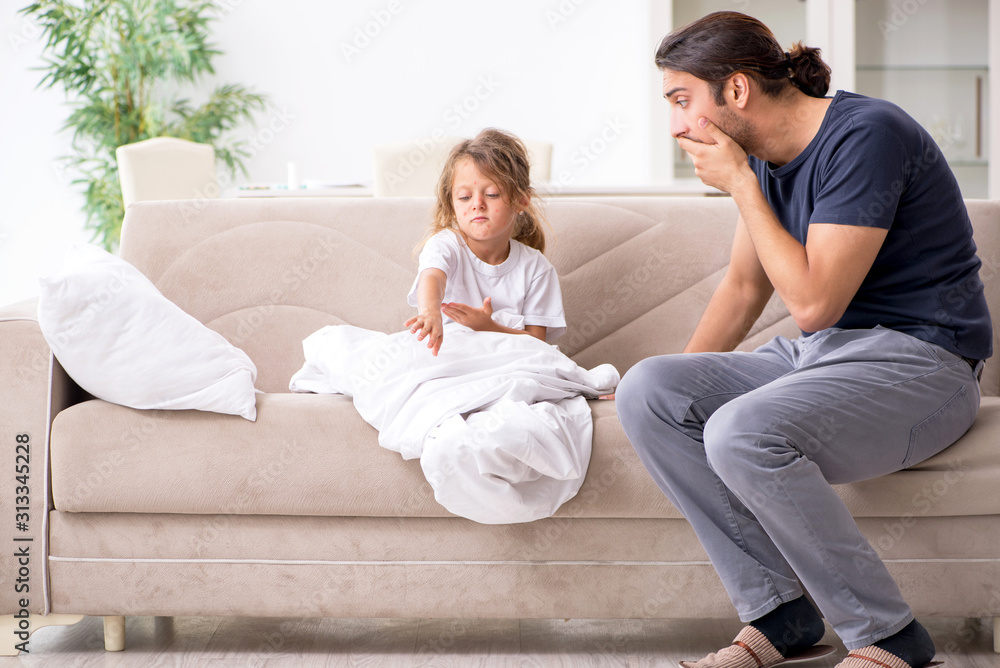 Father taking care of his ill daughter