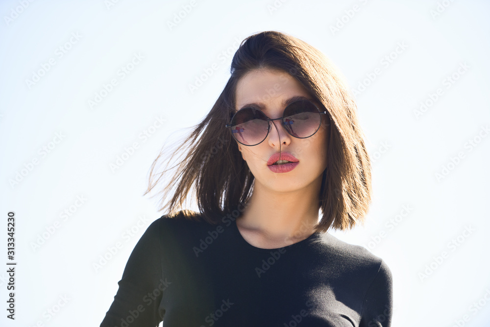 Beauty model girl with sunglasses. Sensual woman. Beautiful fashion model posing with glasses. Beautiful young model with big glasses-close up. Beauty model girl with sunglasses. Sensual woman. Beautiful fashion model posing with glasses. Beautiful young model with big glasses-close up.