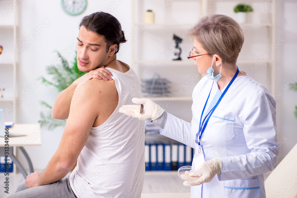 Young patient visiting doctor in hospital Young patient visiting doctor in hospital