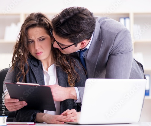 Tablou pe pânză The sexual harassment concept with man and woman in office