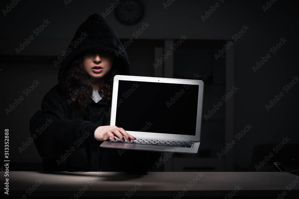 Female hacker hacking security firewall late in office Female hacker hacking security firewall late in office