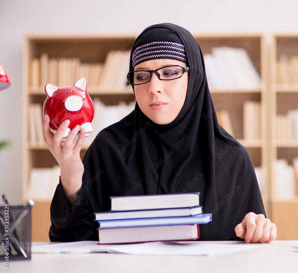 Muslim girl in hijab studying preparing for exams Muslim girl in hijab studying preparing for exams