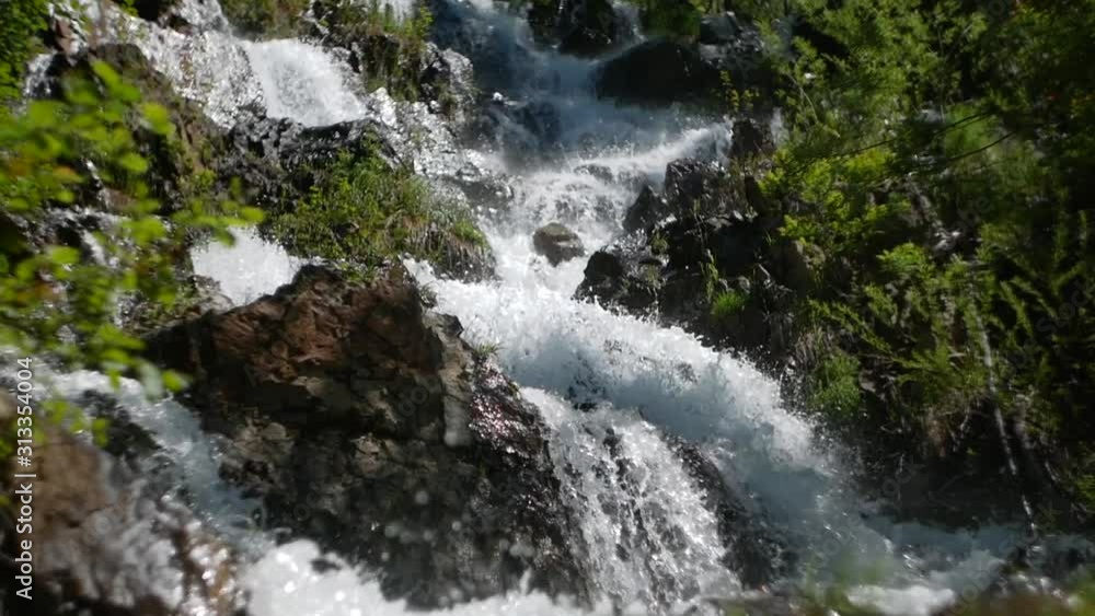 waterfall with big stones spray and foam waterfall with big stones spray and foam