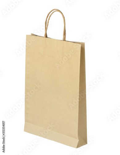 Empty craft brown paper bag on white white background. packaging concept.