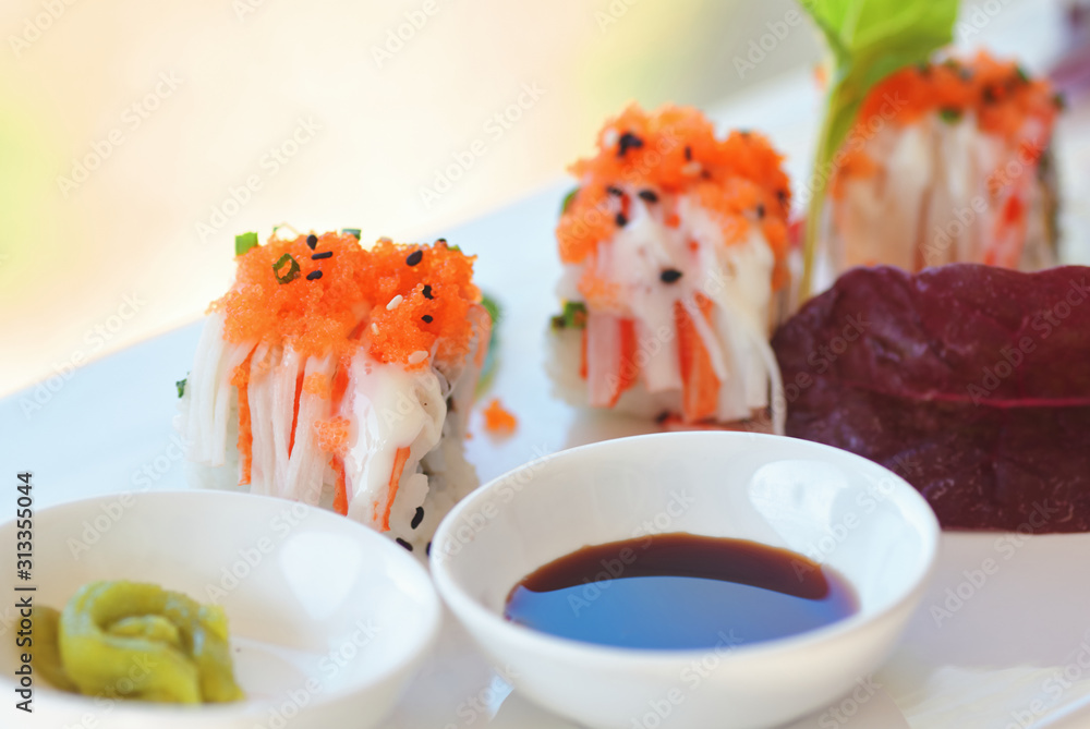 Close-up view of Uramaki sushi with wasabi and soy sauce Close-up view of Uramaki sushi with wasabi and soy sauce