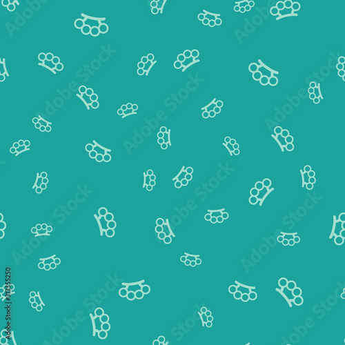 Green Brass knuckles icon isolated seamless pattern on green background. Vector Illustration